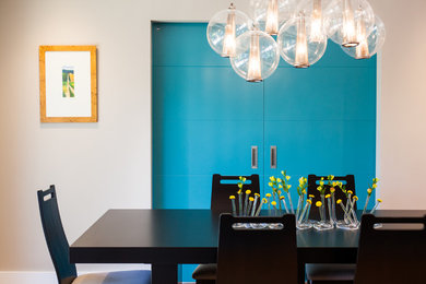 Dining room - large modern light wood floor dining room idea in San Francisco with gray walls