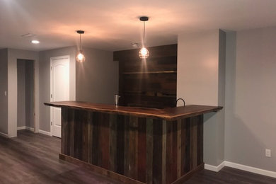 Inspiration for a rustic home bar remodel in Other