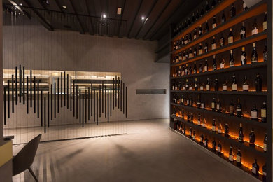 Design ideas for a large world-inspired wine cellar in Rome with porcelain flooring, display racks and grey floors.