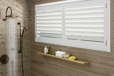 Inspiration for a mosaic tile corner shower remodel in San Diego with beige walls