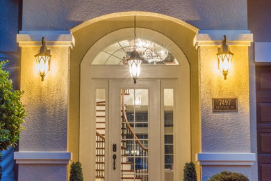 Entryway - transitional ceramic tile entryway idea in Orlando