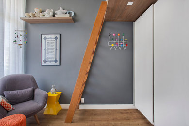 Example of a minimalist kids' room design in Other
