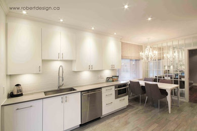 Mid-sized trendy galley ceramic tile eat-in kitchen photo in Montreal with a drop-in sink, flat-panel cabinets, white cabinets, quartz countertops, white backsplash, ceramic backsplash, stainless steel appliances and no island