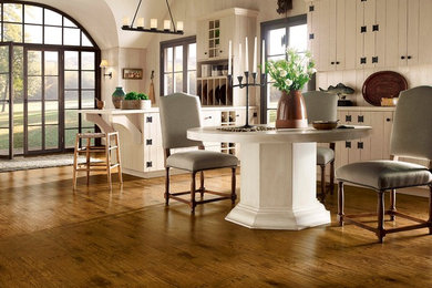Mountain style medium tone wood floor dining room photo in Other with white walls