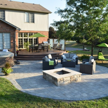 This custom Hickory Dickory Decks shows curves are in with low maintenance Veka.