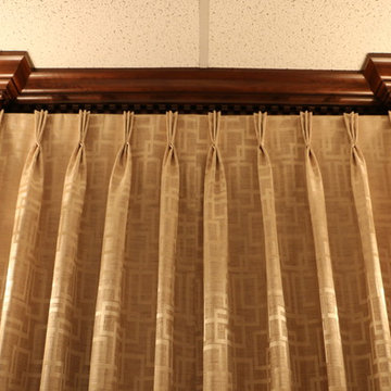 Swags overlaying pinch pleated curtains