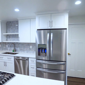 Stainless Steel Appliances in White Cabinetry