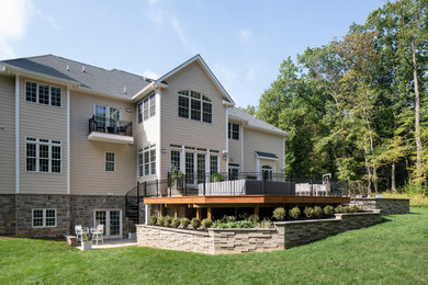 Inspiration for a huge contemporary backyard stone patio kitchen remodel in Other with no cover