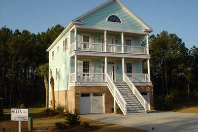 Example of a mid-sized classic blue two-story wood exterior home design in Charleston