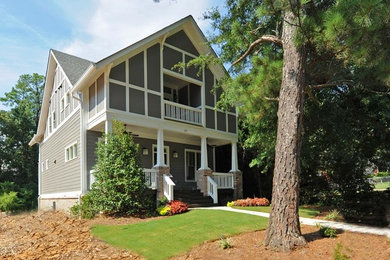 Example of a mid-sized transitional gray mixed siding exterior home design in Atlanta with a shingle roof