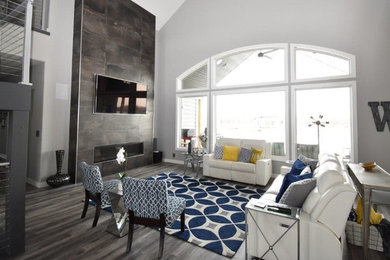 Living room - large transitional open concept vinyl floor and brown floor living room idea in Other with gray walls, a ribbon fireplace, a tile fireplace and a wall-mounted tv