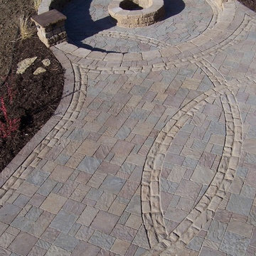 Back-yard paver patio with built in fire ring