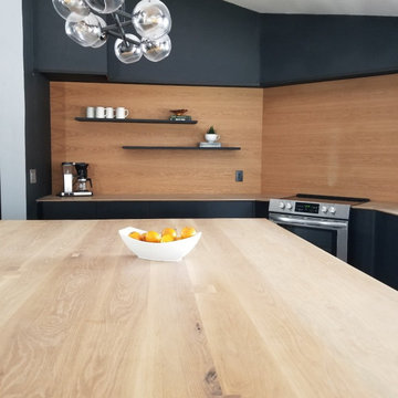 Kitchen with large white oak island