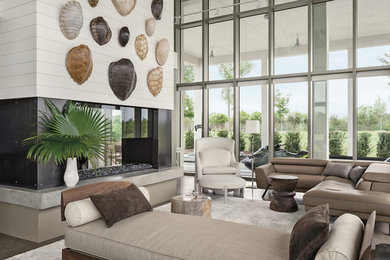 Living room - contemporary formal and open concept living room idea in New Orleans with white walls, a two-sided fireplace and no tv