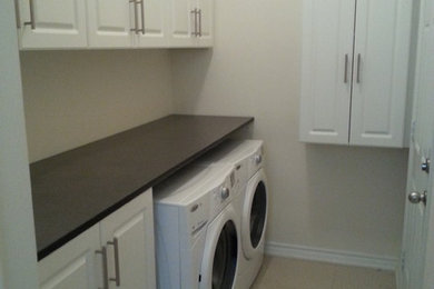 Transitional laundry room photo in Toronto