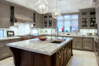 Design ideas for a large traditional u-shaped separate kitchen in New York with an undermount sink, shaker cabinets, grey cabinets, marble benchtops, grey splashback, stainless steel appliances, with island and white floor.