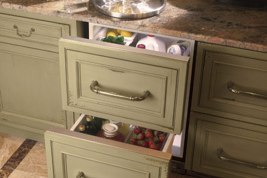 Photo of a mid-sized traditional kitchen in Baltimore with recessed-panel cabinets, green cabinets, granite benchtops, multi-coloured splashback, mosaic tile splashback, marble floors, brown floor and brown benchtop.