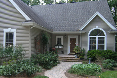 Farmhouse home design photo in Raleigh