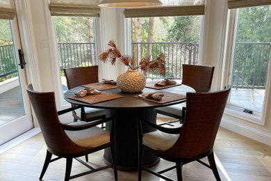 Example of a mid-sized light wood floor breakfast nook design in Seattle with white walls and no fireplace