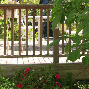 A raised redwood deck was added overlooking the pond and grotto area.
