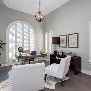 Photo of a large modern study in Los Angeles with grey walls, vinyl flooring, no fireplace and a freestanding desk.