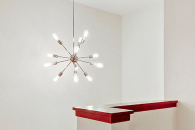 Inspiration for a contemporary carpeted hallway remodel in Calgary with white walls