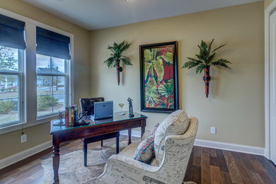 This is an example of a medium sized beach style home office in Other.