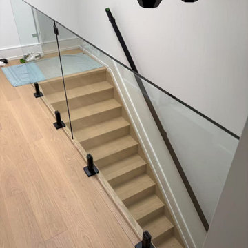 Frameless Glass Stair Railing with Matte Black Hardware