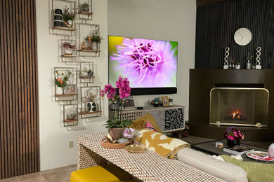Living room - large modern open concept travertine floor, multicolored floor, exposed beam and wood wall living room idea in Other with white walls, a standard fireplace, a concrete fireplace and a wall-mounted tv