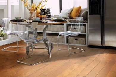 Inspiration for a mid-sized modern dark wood floor and brown floor kitchen/dining room combo remodel in Omaha with white walls