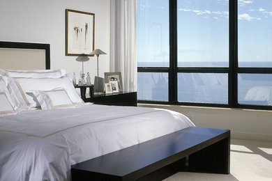 Inspiration for a mid-sized transitional loft-style carpeted and beige floor bedroom remodel in Miami with white walls and no fireplace