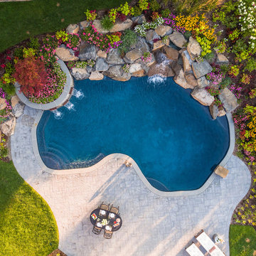 drone view of custom pool with waterfalls