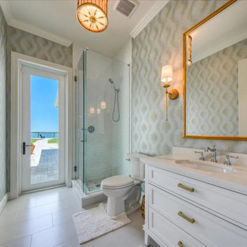 Coastal Bathroom With Marble Elegance and Glass Shower Design