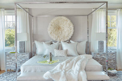 Large trendy guest light wood floor bedroom photo in New York with gray walls and no fireplace