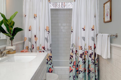 Example of a transitional white tile and subway tile mosaic tile floor bathroom design in Baltimore with recessed-panel cabinets, gray walls and an undermount sink