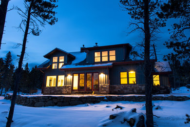 Inspiration for a large rustic gray two-story mixed siding exterior home remodel in Denver