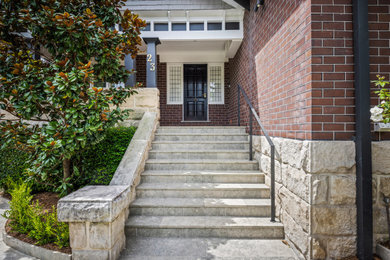 Large contemporary front door in Sydney with a single front door, a black front door and brick walls.