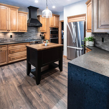 Reconfigured kitchen with new islands, countertops, backsplash