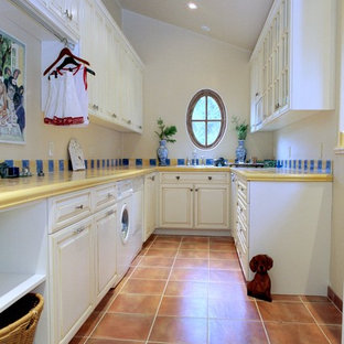 Photo of a classic utility room in San Francisco with terracotta flooring and yellow worktops.