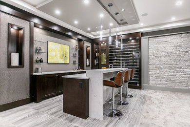 Photo of a transitional galley home bar in Vancouver with shaker cabinets, dark wood cabinets, quartz benchtops and white benchtop.