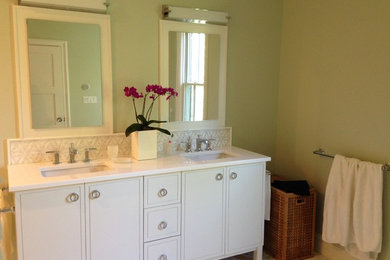Mid-sized transitional master white tile and ceramic tile mosaic tile floor and white floor bathroom photo in New York with flat-panel cabinets, white cabinets, green walls, an undermount sink, quartz countertops and a hinged shower door