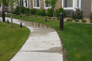 Inspiration for a large craftsman drought-tolerant and full sun courtyard concrete paver garden path in Denver for fall.
