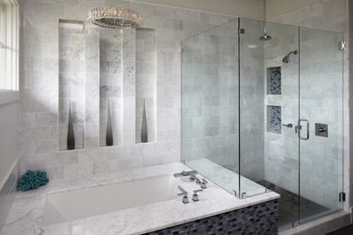 Inspiration for a large contemporary master gray tile and stone tile corner shower remodel in Other with an undermount tub, gray walls and a hinged shower door