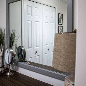 Gray Bathroom with Tiled Shower and Make-Up Area