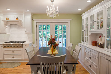 Inspiration for a large contemporary eat-in kitchen remodel in Boston with louvered cabinets, white cabinets, white backsplash, subway tile backsplash and stainless steel appliances