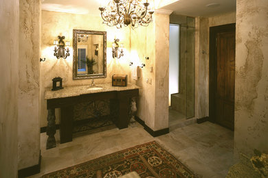 Example of a tuscan home design design in Denver