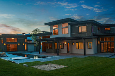 Modern gray two-story exterior home idea in Other