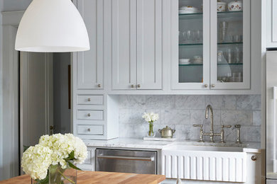 Elegant single-wall medium tone wood floor and brown floor wet bar photo in Birmingham with shaker cabinets, gray cabinets and gray backsplash