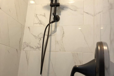 Bathroom - white tile and marble tile bathroom idea in Salt Lake City