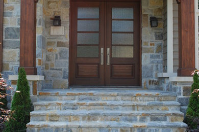 Entryway - transitional entryway idea in Montreal with a dark wood front door